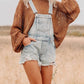 Distressed light-wash denim overalls shorts with frayed hem