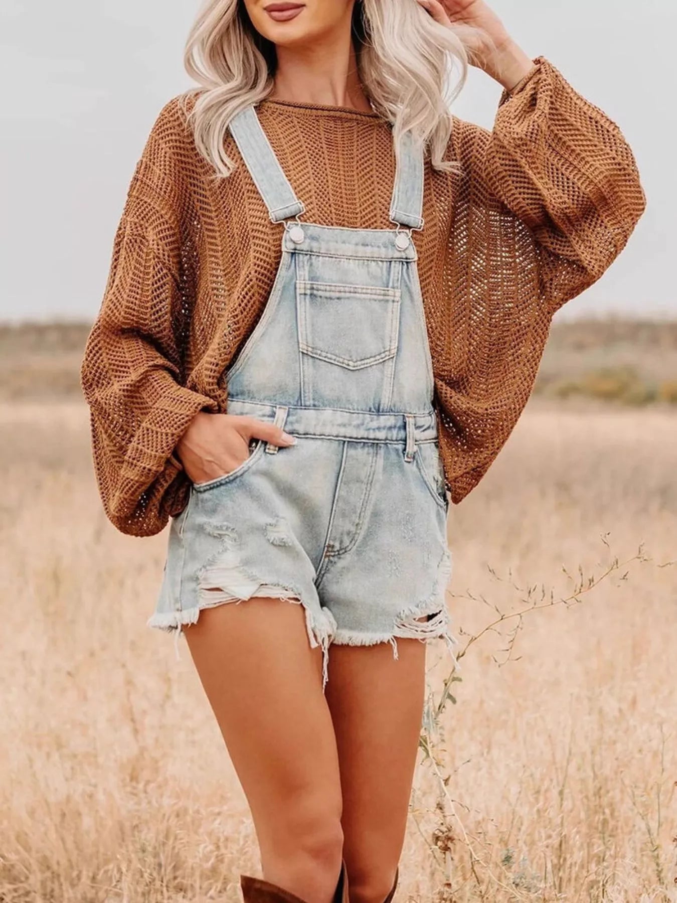 Distressed light-wash denim overalls shorts with frayed hem