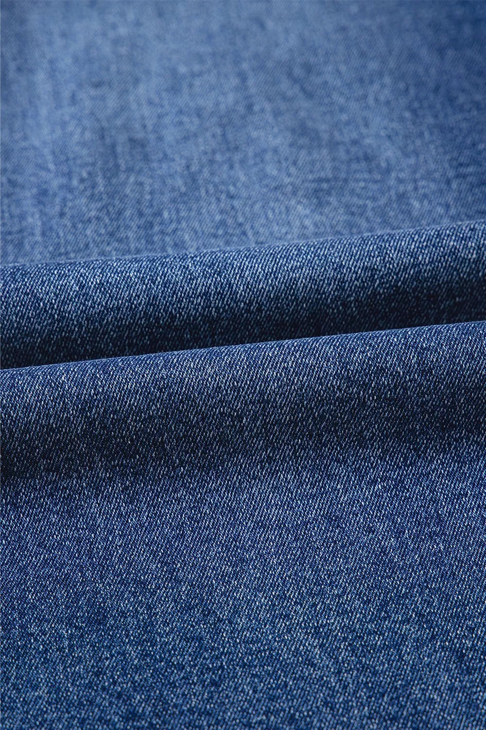 Dark blue denim with textured woven pattern in Daverri jeans