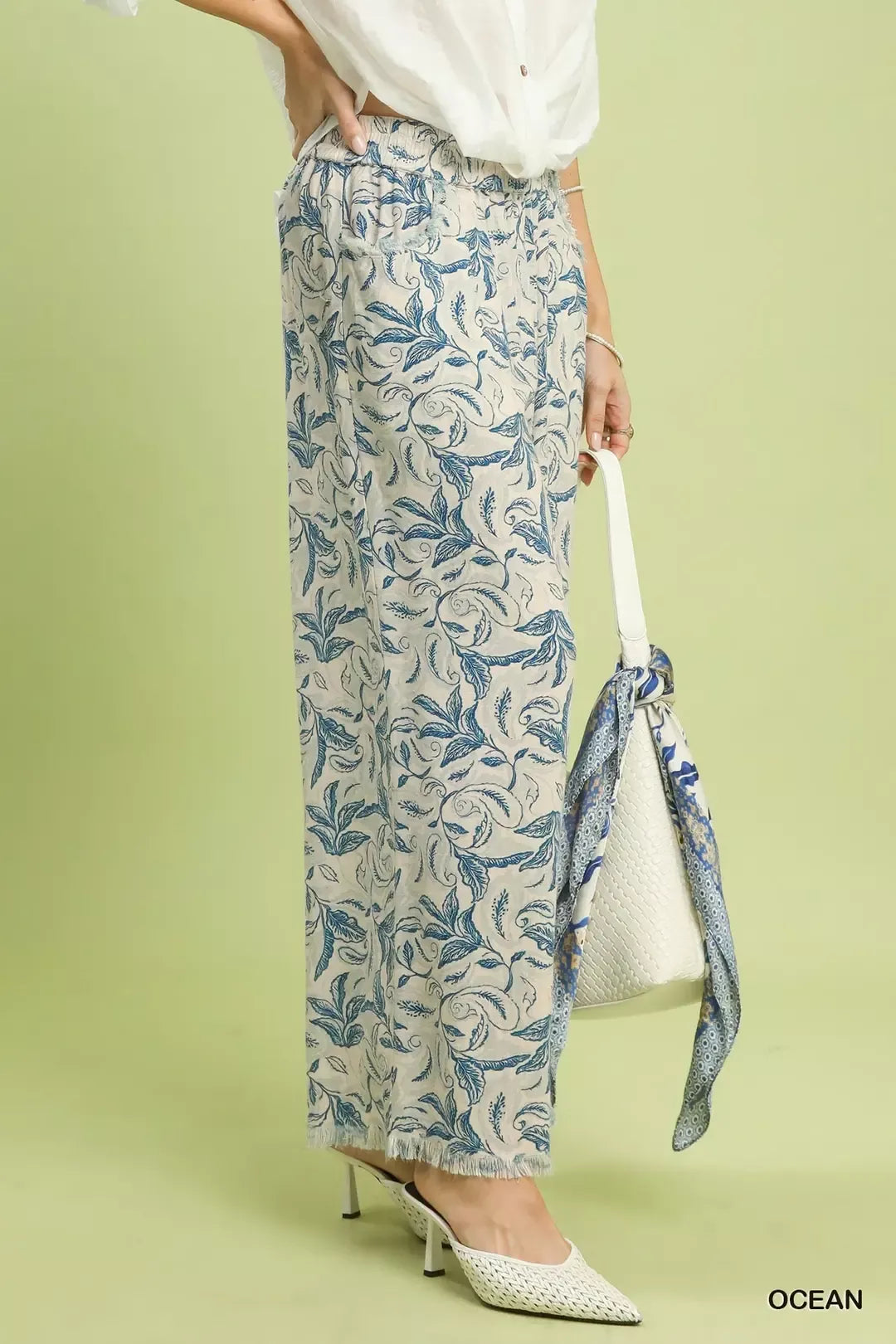 Umgee beige linen wide-leg pants with blue botanical print and raw frayed hems