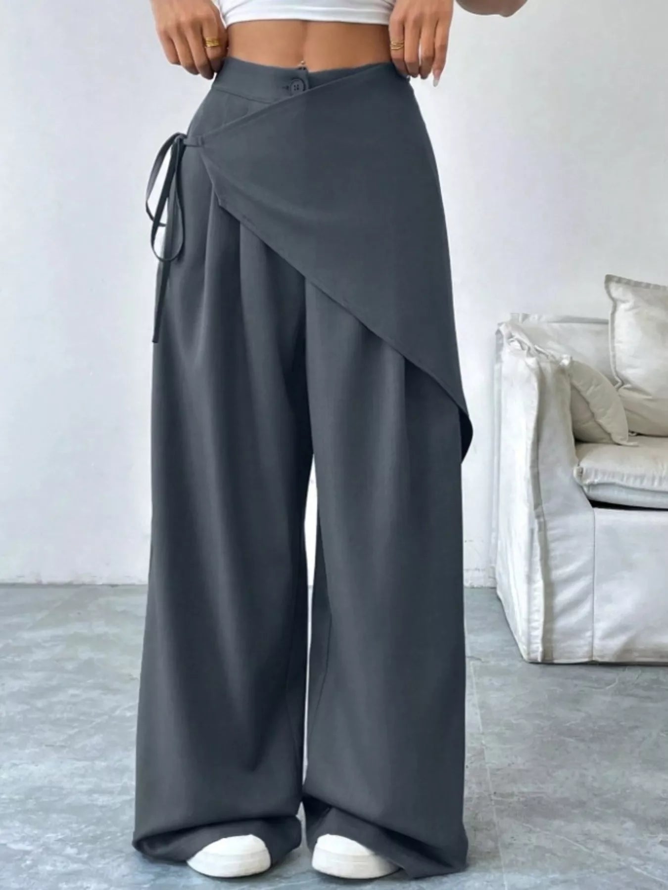 Daverri wrap-front wide-leg pants in dark gray with draped asymmetrical front and side tie detail