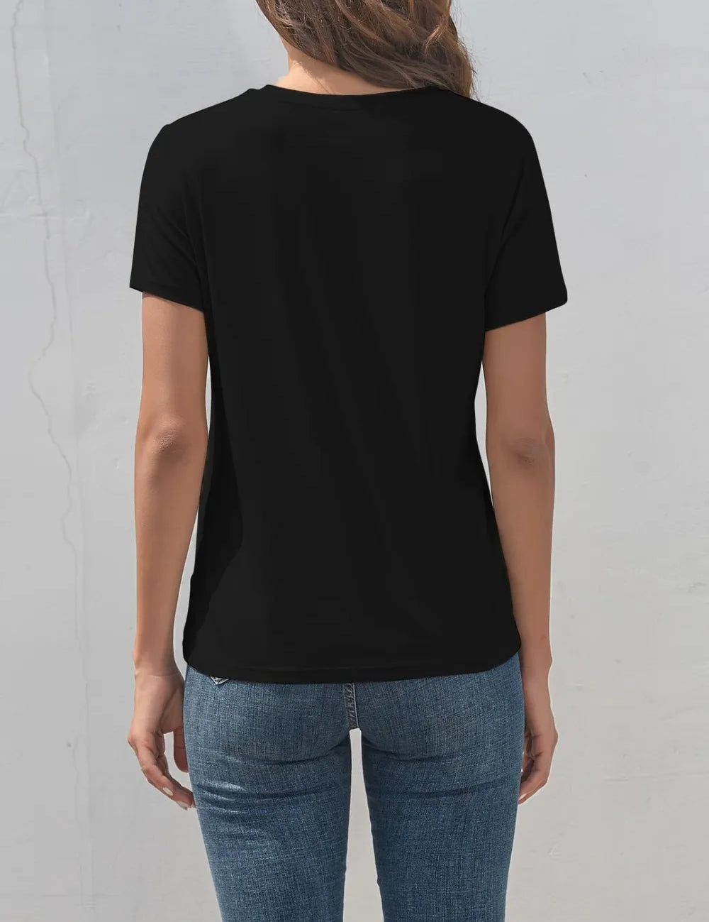 Black short-sleeved round neck t-shirt with letter graphic and jeans
