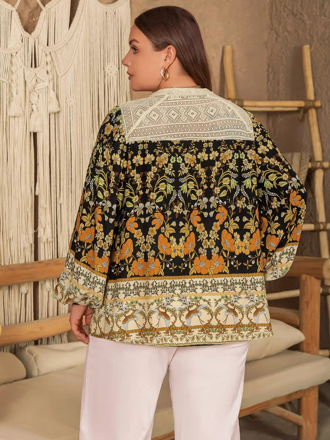 Plus size floral print notched blouse in black with orange green patterns and cream lace