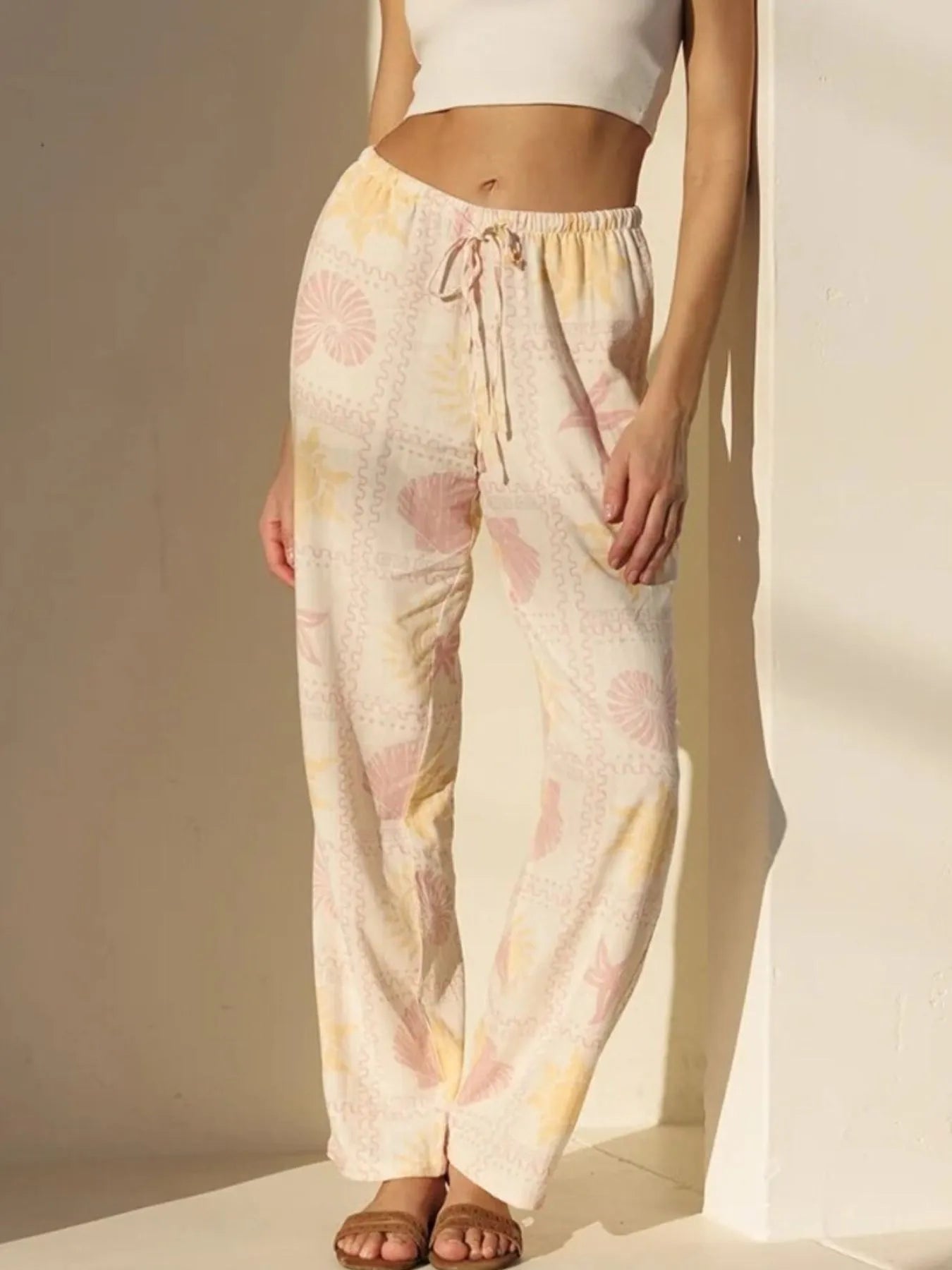 Pastel floral wide-leg pants in cream, pink, yellow with drawstring waist