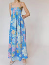 Flowing blue floral print sleeveless maxi dress with spaghetti straps