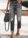 Distressed wash ankle jeans with frayed hems and ripped knees