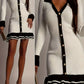 Daverri ribbed knit sweater dress in white with black trim and gold buttons