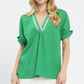 Green Umgee textured V-neck blouse with ruffled cuffs and lace trim