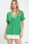 Green Umgee textured V-neck blouse with ruffled cuffs and lace trim