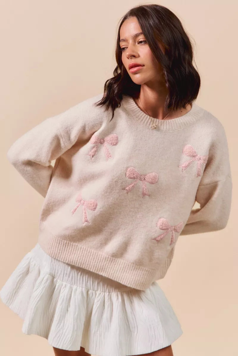 Cream-colored SO ME knit sweater with pink embroidered bows