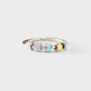 Silver ring with colorful cylindrical beads on a white background