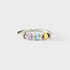 Silver ring with colorful cylindrical beads on a white background