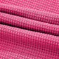 Vibrant pink waffle-knit textured fabric in solid color buttoned shirt and pants set