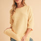 Aemi + Co Side Slit Ribbed Hem Round Neck Sweater Sweaters