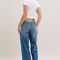 Judy Blue mid-rise jeans with blue denim flare legs and tan corduroy waistband