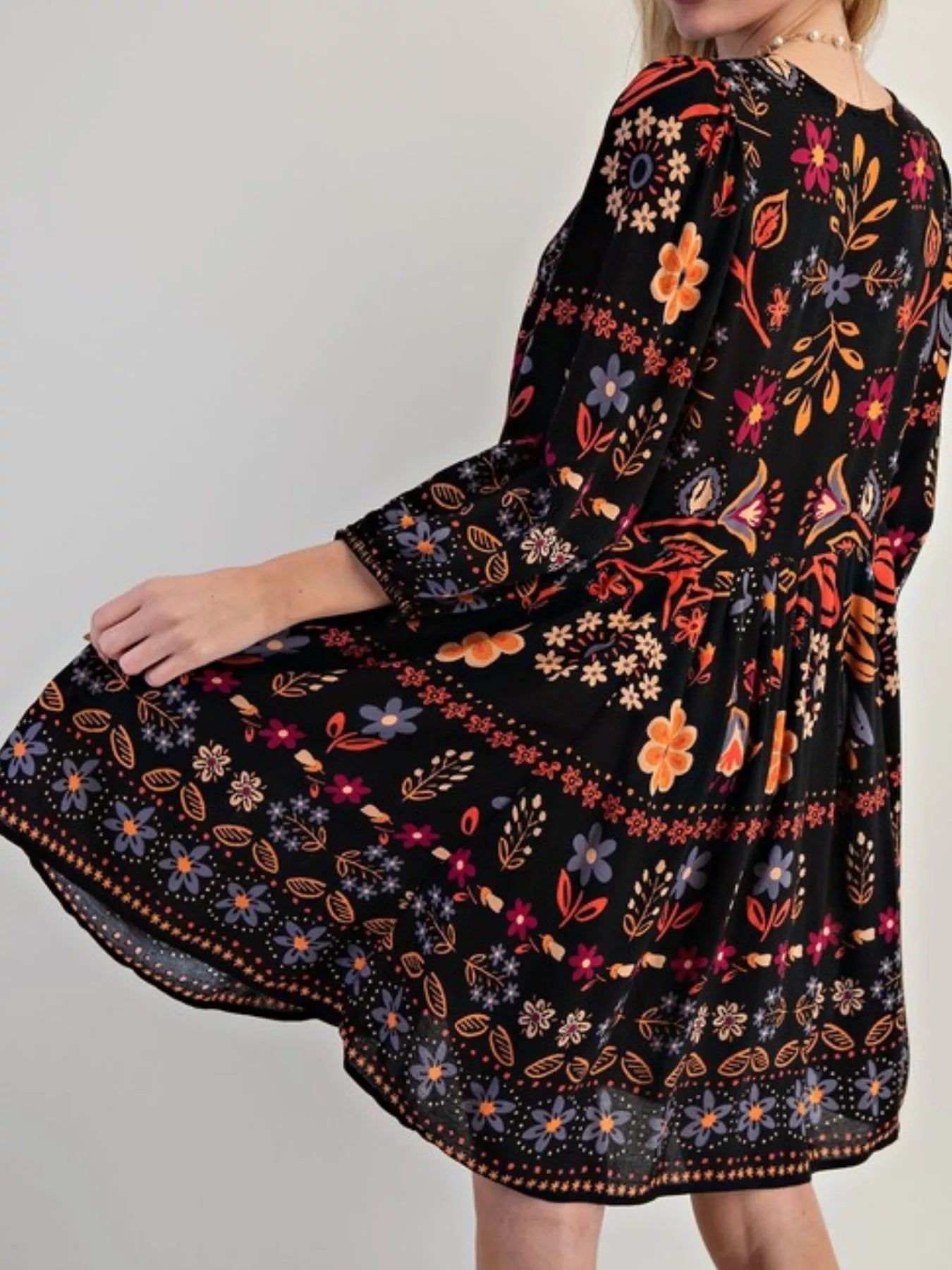 Bohemian floral print long sleeve mini dress with vibrant flowers