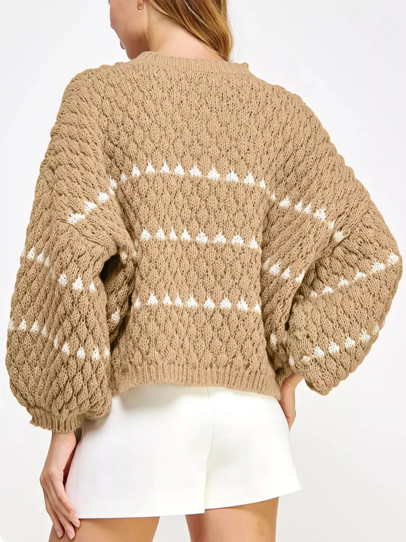 Cozy beige women’s cable-knit sweater with white triangular back patterns
