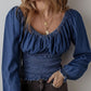 Blue smocked long sleeve denim top with detailed sleeves