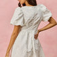 White textured floral mini dress with puffed sleeves, SO ME jacquard