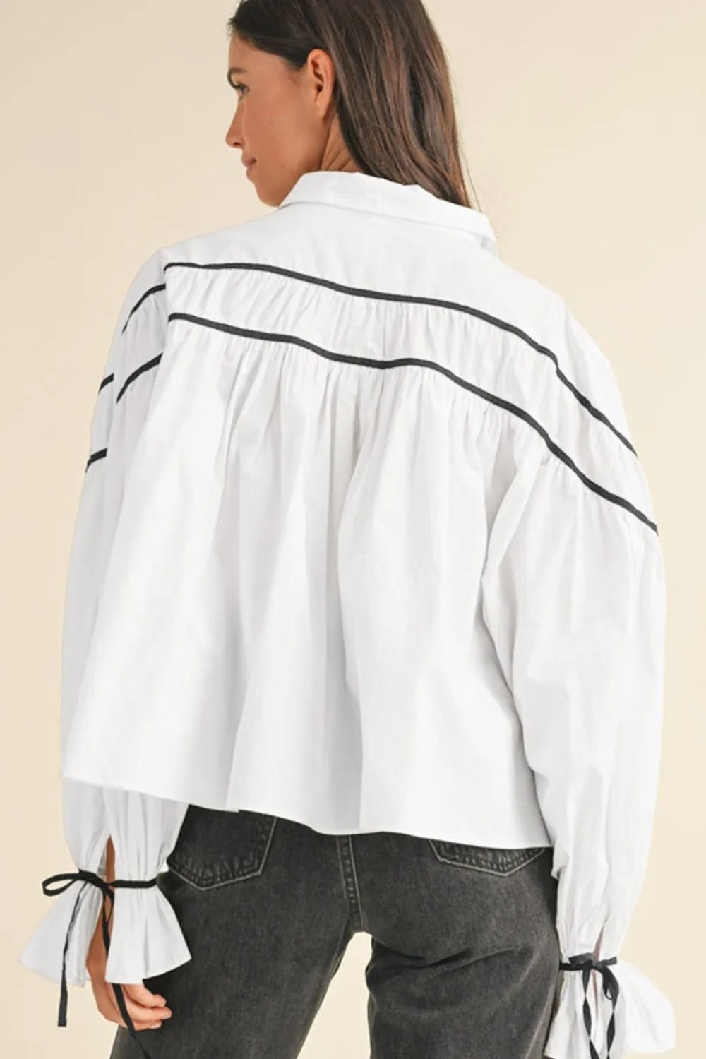 White striped blouse with ribbon bowtie collar and flounce sleeves