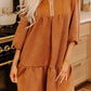 Cozy rust-colored ruffled hem zip front texture dress in herringbone pattern