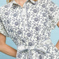Umgee Border Print Belted Shirt Dress in white with navy floral pattern