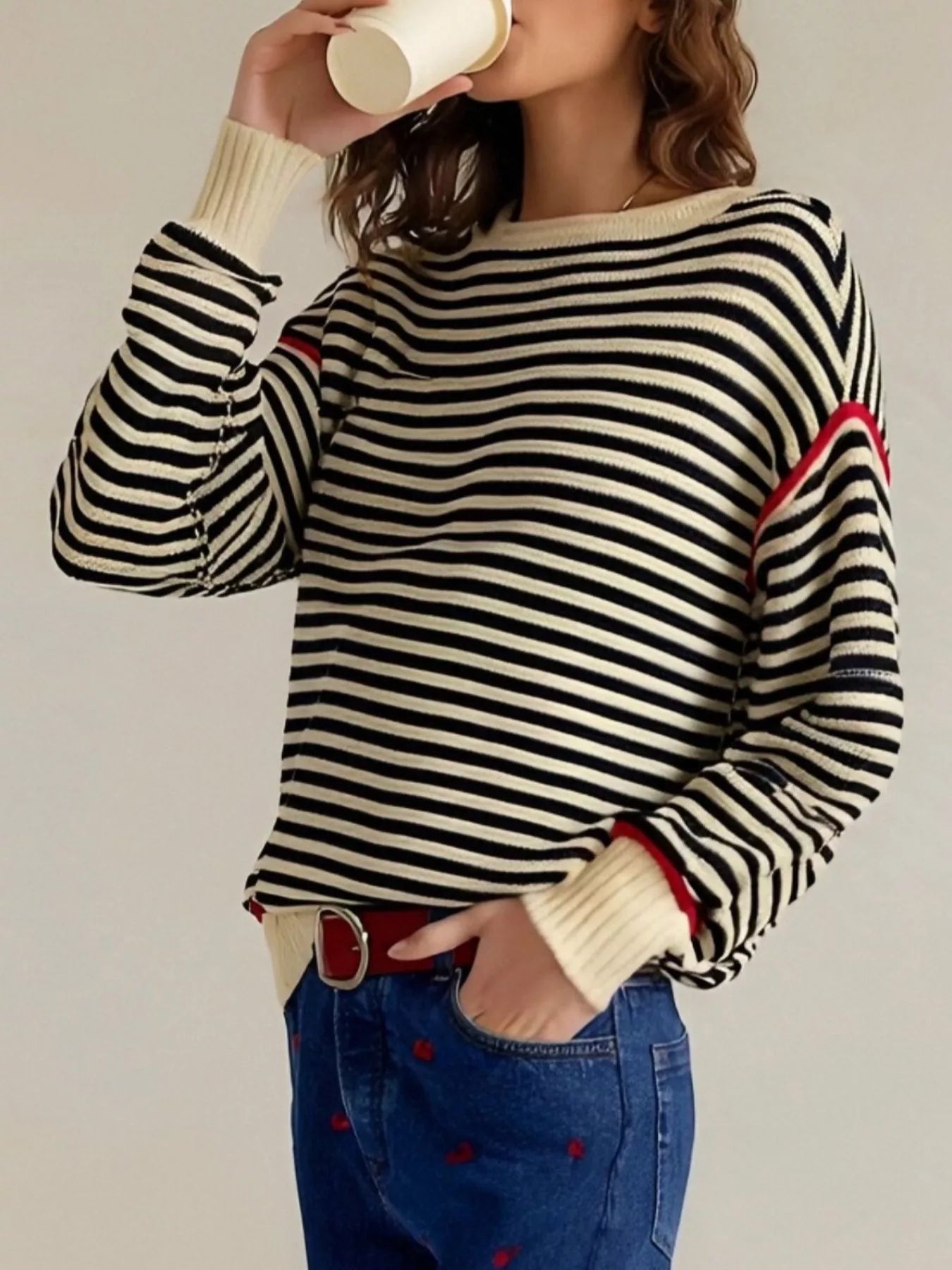 Black and white striped round neck long sleeve knit sweater with red trim