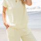 Cream-colored textured knit top with short flutter sleeves from Daverri set