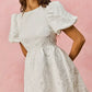 White textured floral jacquard mini dress with puffed short sleeves