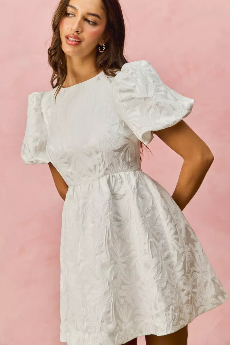 White textured floral jacquard mini dress with puffed short sleeves