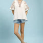 Umgee embroidered sleeve contrast trim top in cream with floral patterns