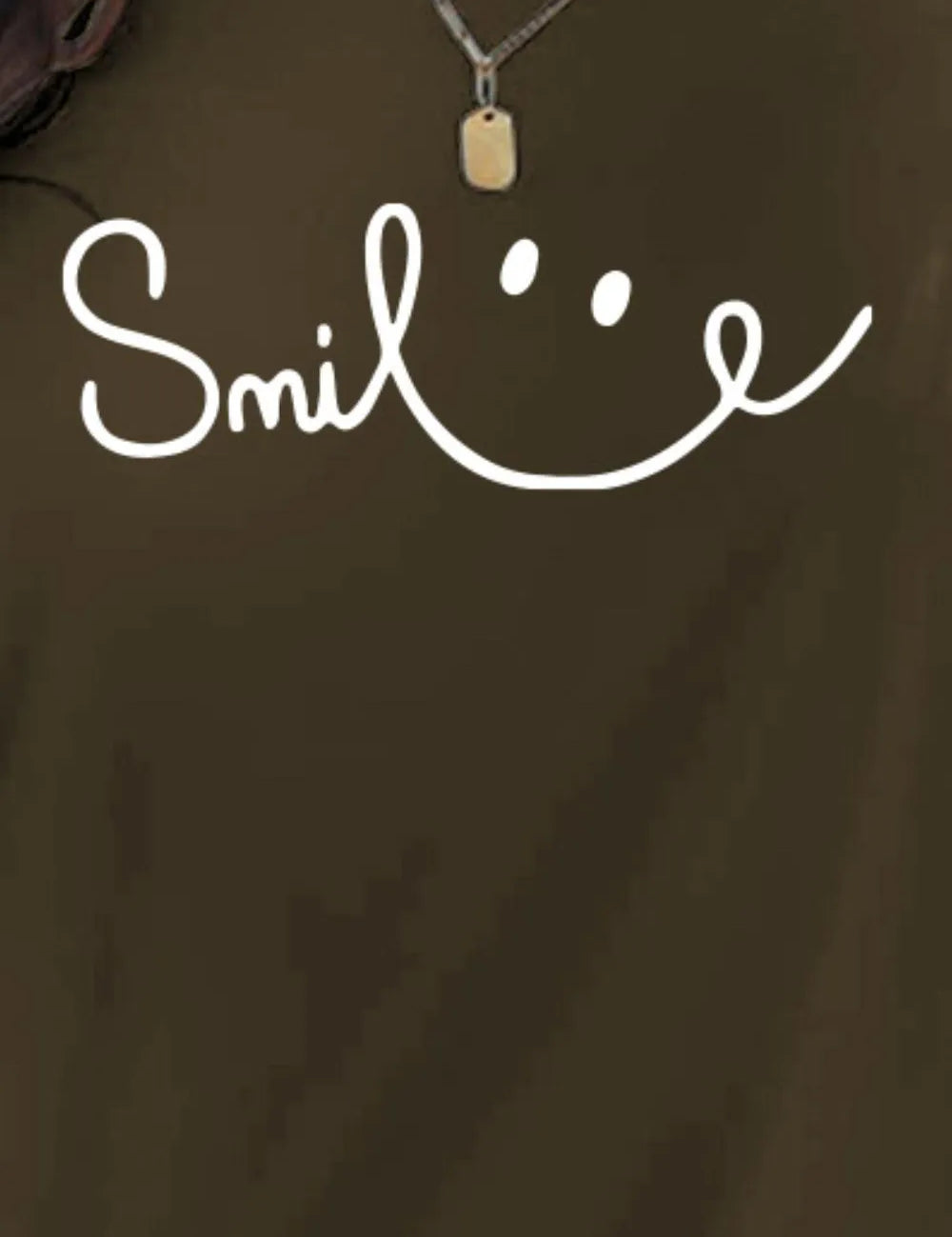 Gold dog tag necklace with smiley face on SMILE t-shirt
