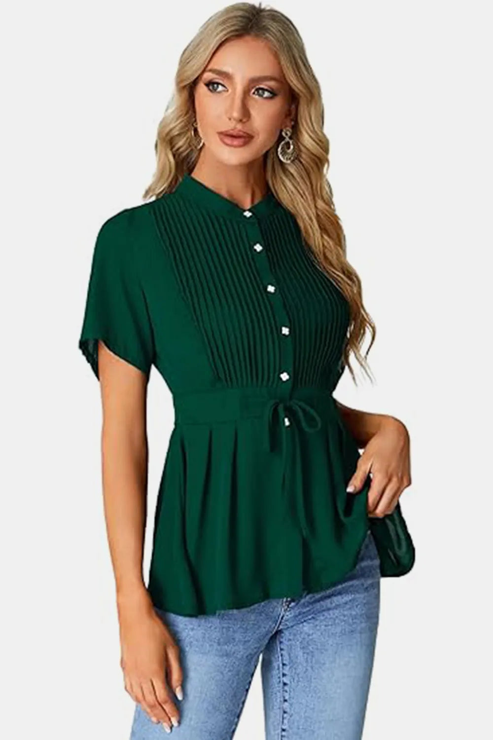 Emerald green peplum blouse with tied round neck, short sleeves, pleated front, white buttons