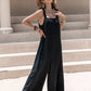 Black velvet sleeveless wide-leg jumpsuit with tie shoulder straps