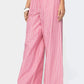 Pink and white striped wide-leg pants with drawstring waist and pockets