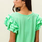 BiBi Birdseye Texture Layered Ruffle Top in vibrant mint green waffle-knit fabric