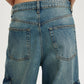 Vintage wash wide leg cargo jeans in medium-wash blue denim with side pockets
