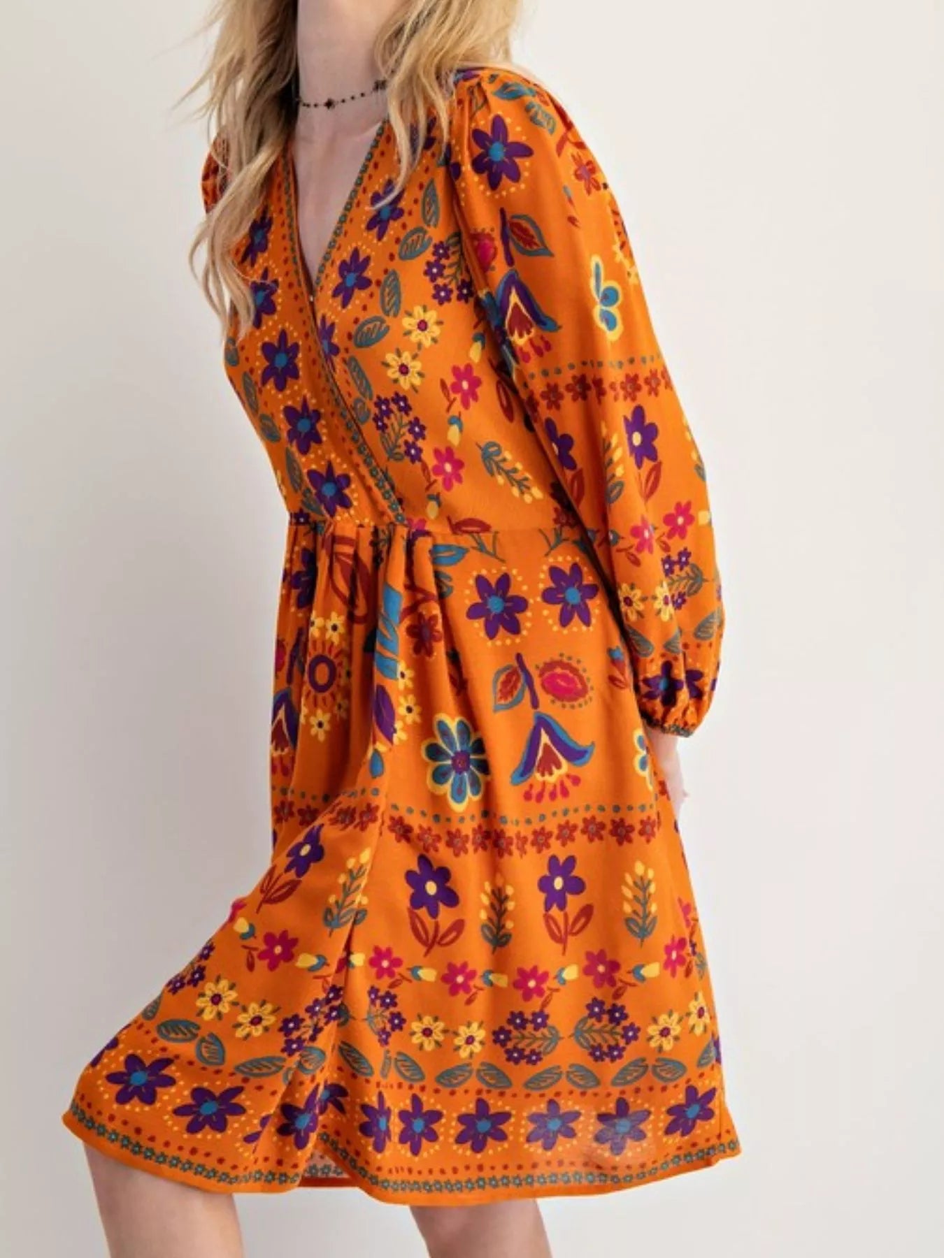 Bohemian floral print long sleeve mini dress with vibrant orange flowers