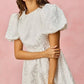 White floral jacquard mini dress with puffed bubble sleeves and fitted waist