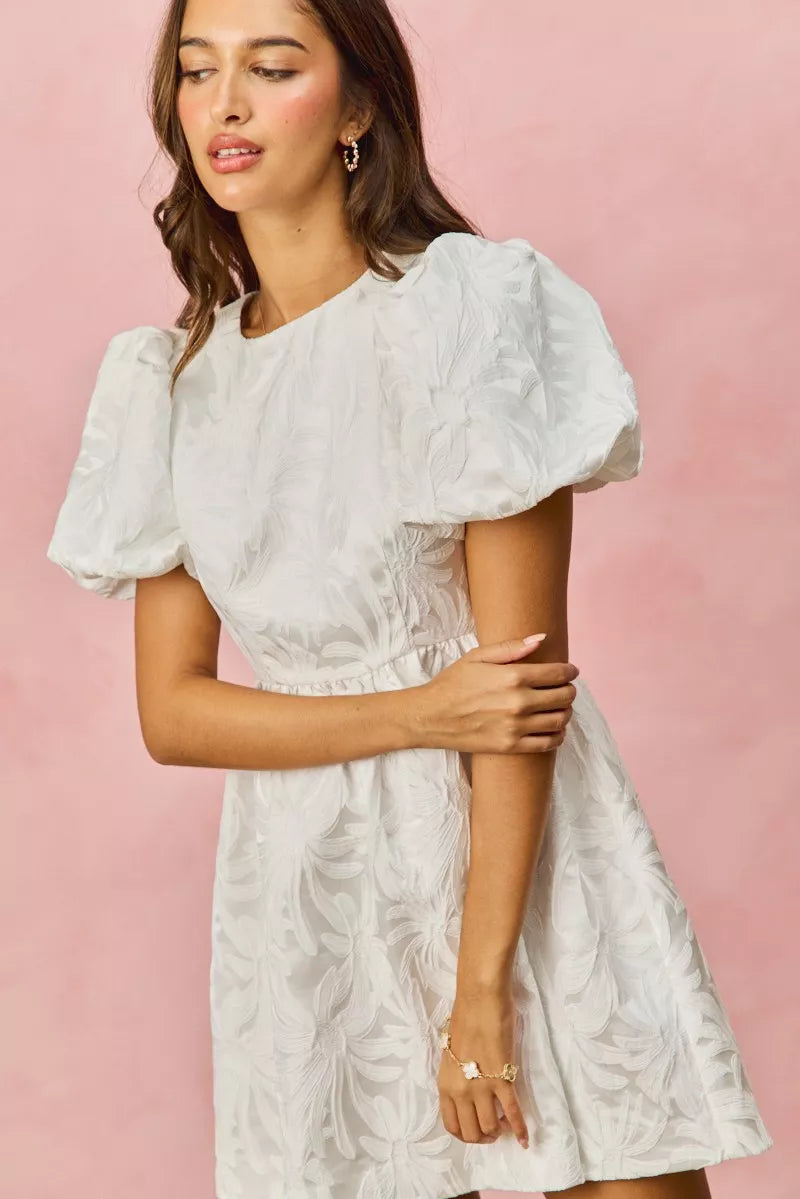 White floral jacquard mini dress with puffed bubble sleeves and fitted waist