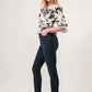 Black skinny jeans with And The Why smocked floral off-shoulder top and clear heels