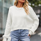 White cropped round neck drop shoulder sweater with ribbed cuffs and hem