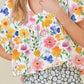 Floral boxy fit ruffled short sleeve blouse with vibrant pink yellow blossoms