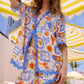 Vibrant bohemian print button-up shirt and shorts beach set in white, blue, orange with scalloped edges