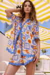 Vibrant bohemian print button-up shirt and shorts beach set in white, blue, orange with scalloped edges