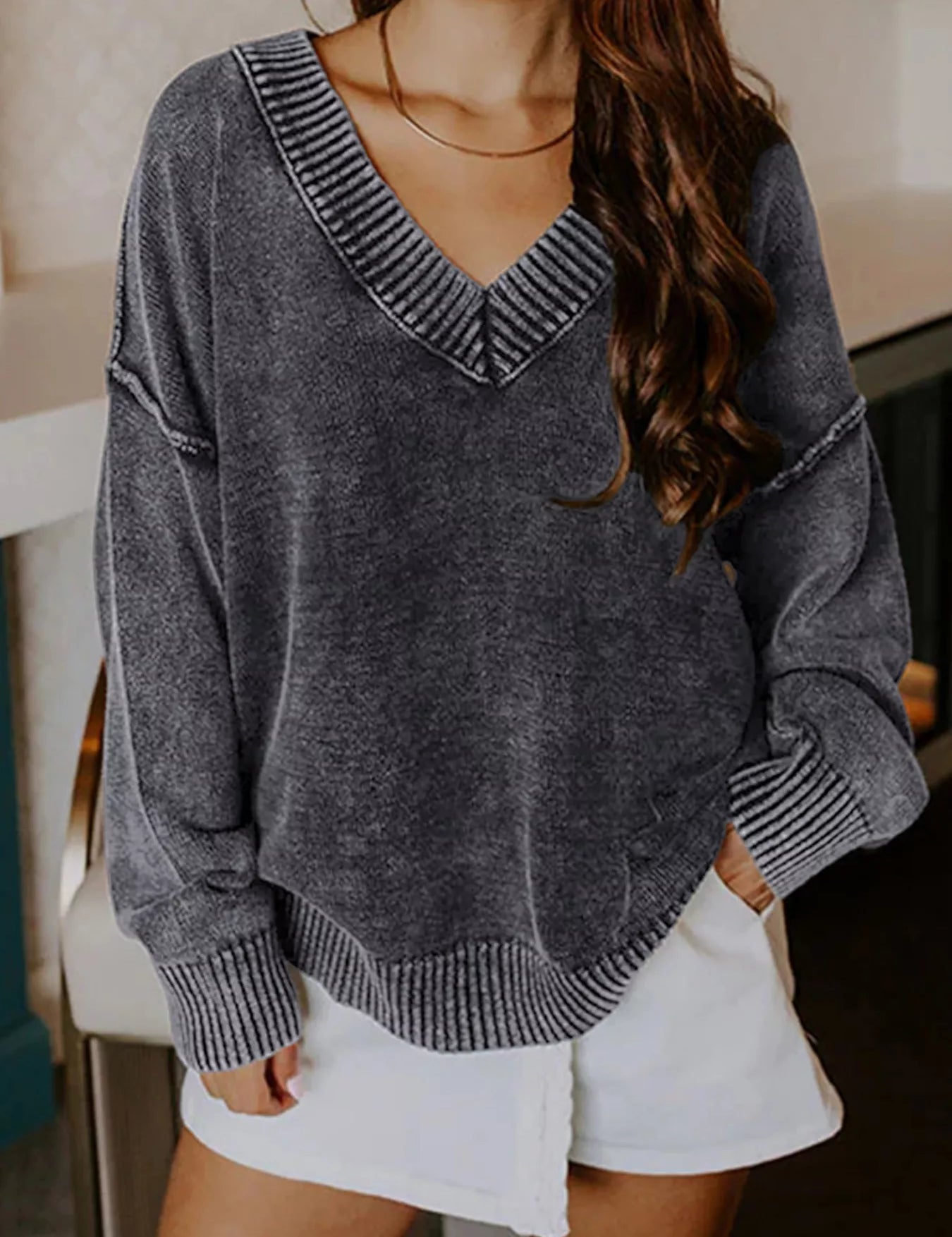 Charcoal gray washed cotton V-neck sweater with ribbed trim and pockets