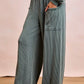 BiBi loose cyan vertical stripe knit wide-leg pants with pockets and elastic waist