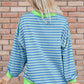 Blue and light green striped high-low long sleeve sweatshirt with neon green ribbed trim