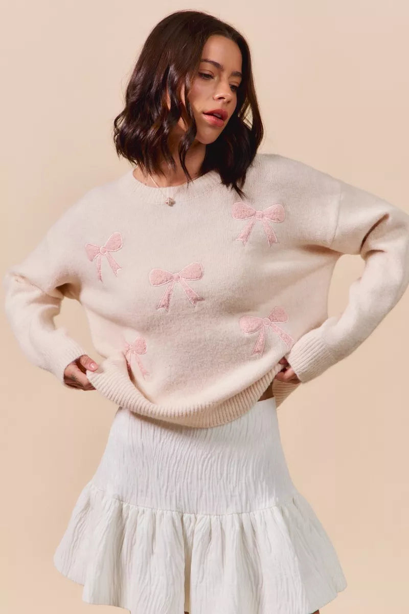 Cream-colored SO ME knit sweater with pink embroidered bows