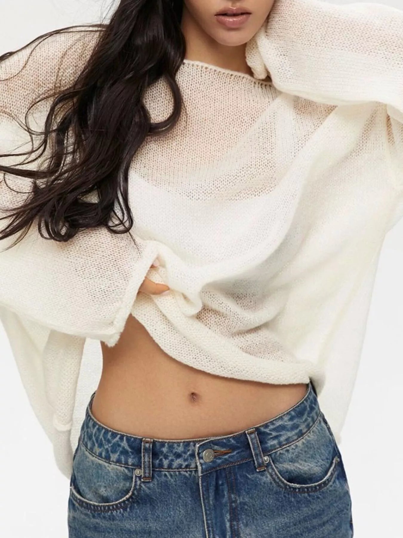 Boat neck dropped shoulder sweater in loose off-white knit with sheer texture and wide sleeves